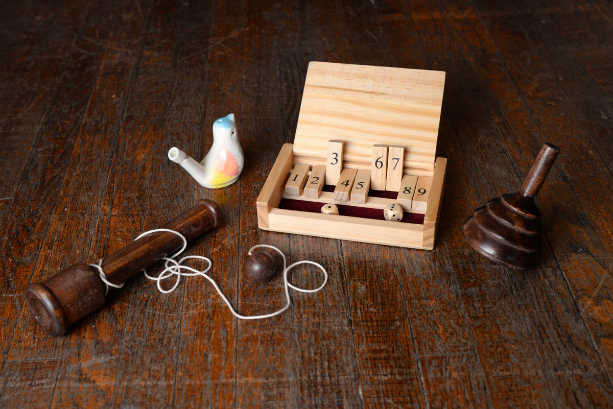 18th Century Game Bundle - shut the box, bird whistle, spinning top, and ball and cup